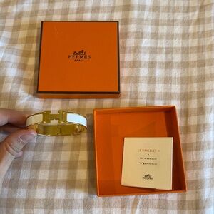 Hermes bangle bracelet in white & gold.